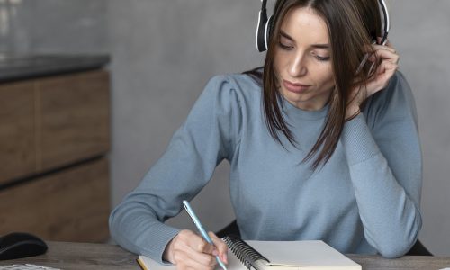 front-view-woman-working-media-field-with-headphones